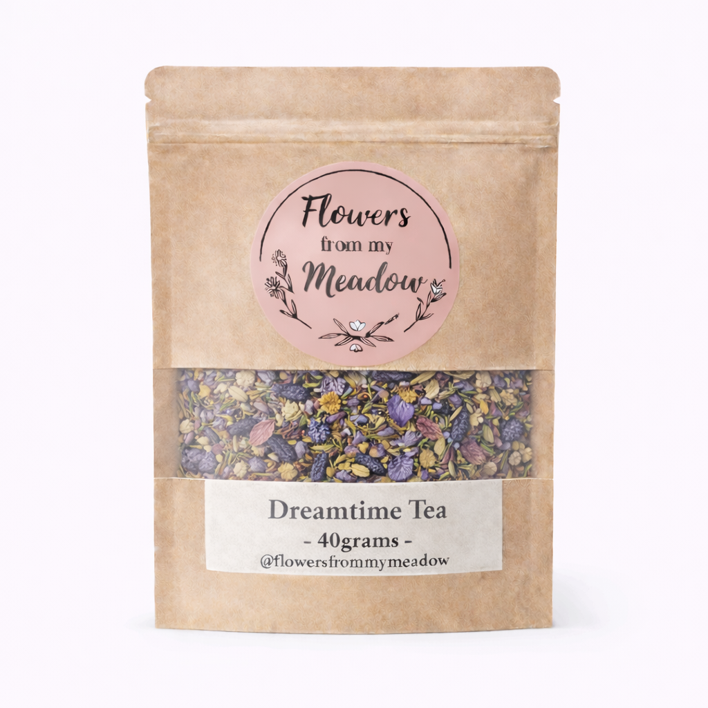Kraft paper packaging of 'Dreamtime Tea' with floral elements on a white background