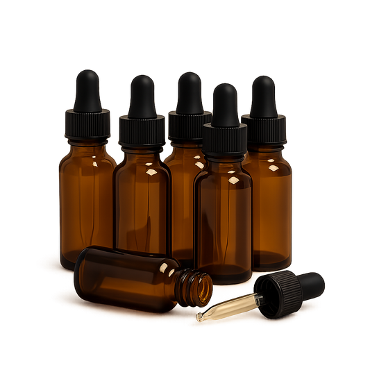 Set of six amber glass dropper bottles with black caps on a white background