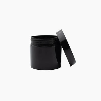 Black cylindrical container with a lid on a white background