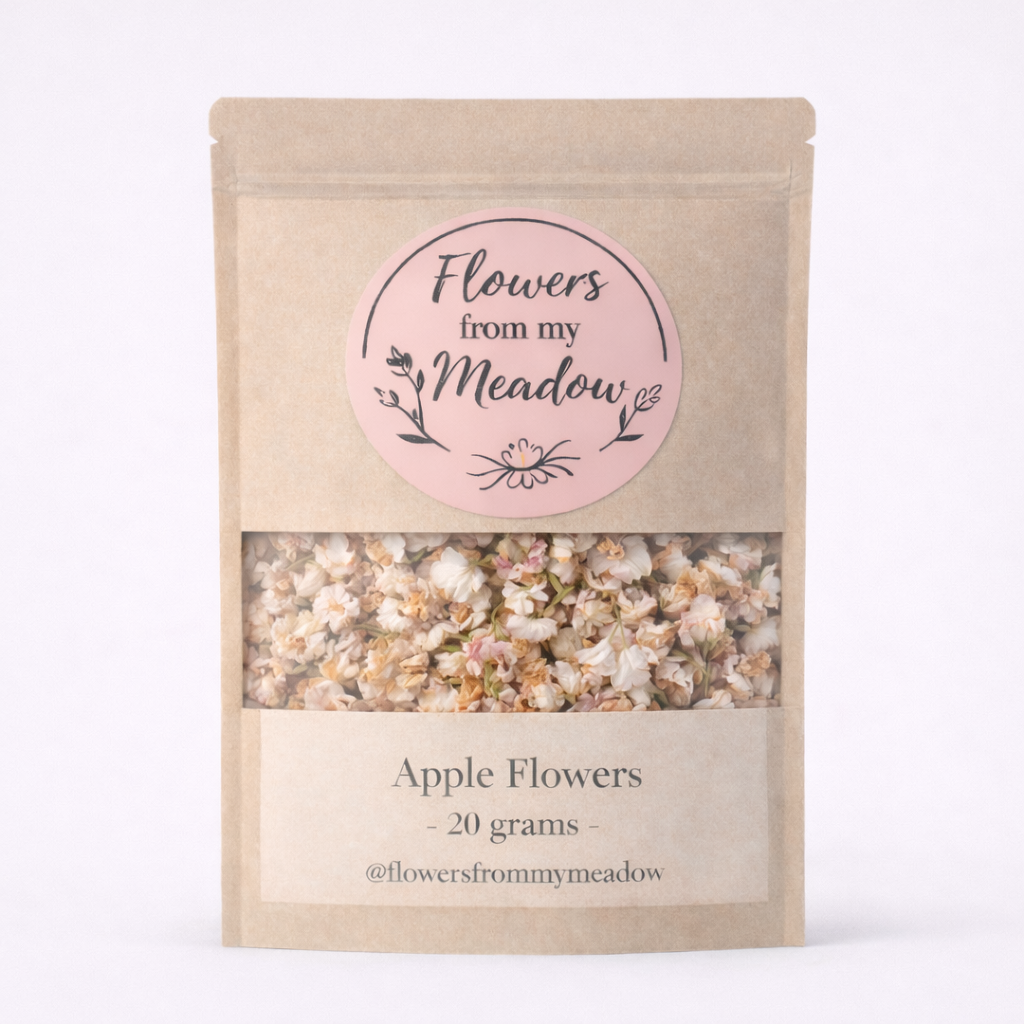Package of 'Flowers from my Meadow' with a pink label and visible apple flowers inside.
