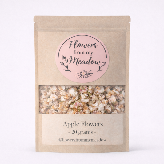 Package of 'Flowers from my Meadow' with a pink label and visible apple flowers inside.