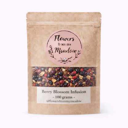 Kraft paper packaging of Berry Blossom Infusion with visible berries on a white background