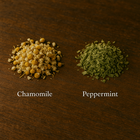 Dried chamomile and peppermint leaves on a wooden surface