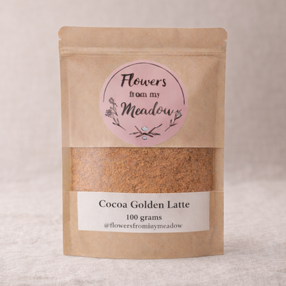 Kraft paper packaging of Cocoa Golden Latte with a pink label on a light background