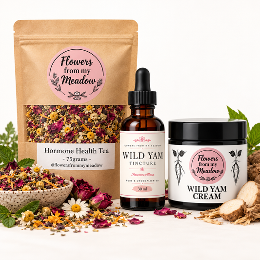 Flowers from my Meadow Menopause & Hormone Health Pack on a light studio background: Hormone Health Tea 75g, Wild Yam Tincture 30ml and Wild Yam Cream 50ml.