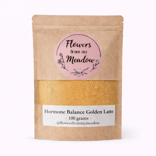 Kraft paper packaging of 'Hormone Balance Golden Latte' with a pink label on a white background