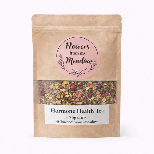 Hormone health tea package with visible flowers on a white background