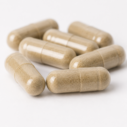 Several beige herbal supplement capsules arranged on a clean white background.