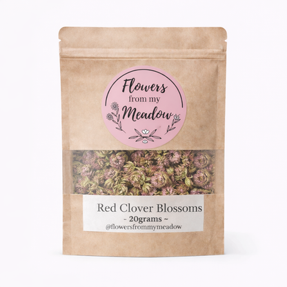Kraft paper packaging with a label for Red Clover Blossoms from 'Flowers from my Meadow' on a white background.
