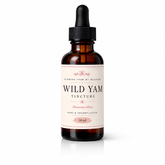 An amber glass dropper bottle of Flowers From My Meadow Wild Yam Tincture on a clean white background.