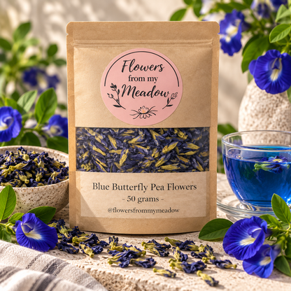 Blue Butterfly Pea Flowers 50 g resealable kraft pouch with dried blue flowers, styled with fresh butterfly pea blooms and vivid blue botanical tea