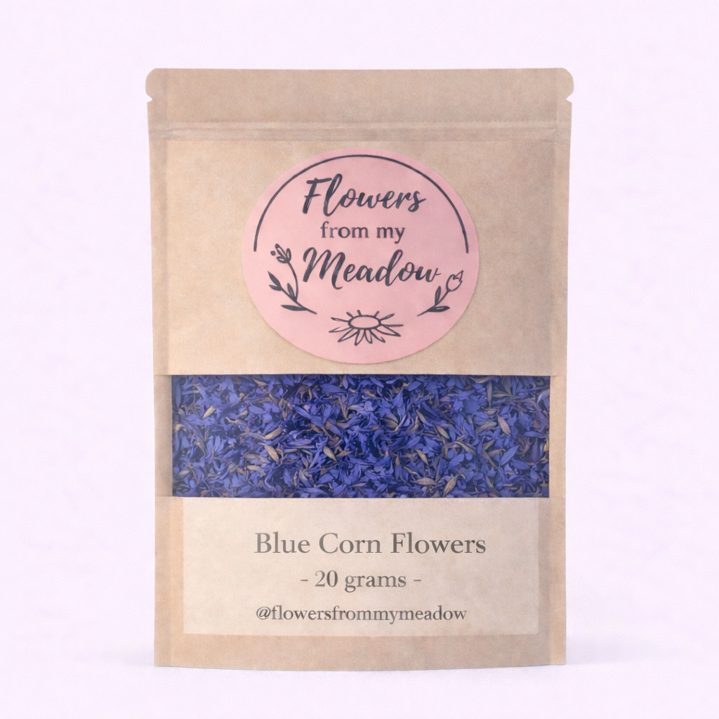 Kraft paper packaging with blue corn flowers and 'Flowers from my Meadow' label on a light pink background