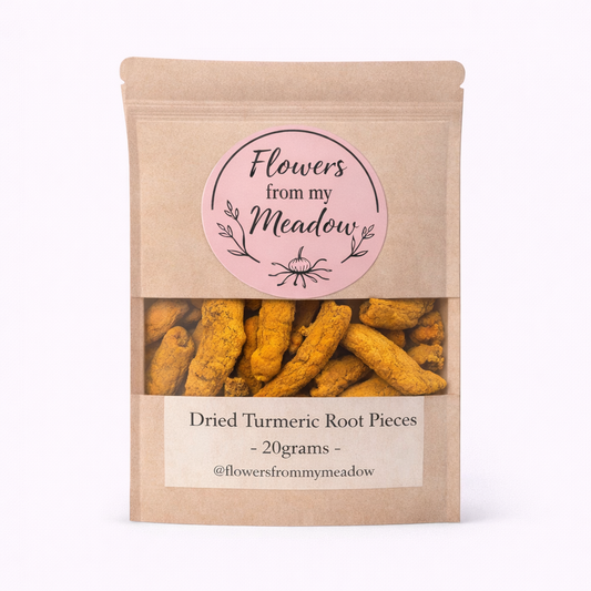 Package of dried turmeric root pieces with 'Flowers from my Meadow' label on a white background