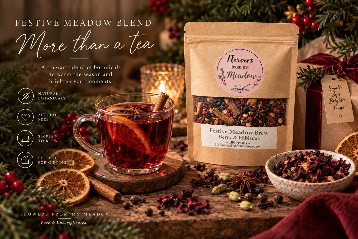 Festive Meadow Blend Berry and Hibiscus served as a warm alcohol-free botanical drink with orange and whole spices