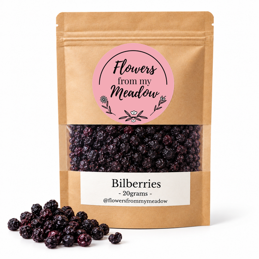 Flowers from my Meadow Bilberries 20g kraft stand-up pouch with pink round logo, viewing window showing whole dried bilberries and white label, on a white background