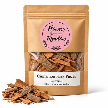 Flowers from my Meadow Cinnamon Bark Pieces 50g in a kraft stand-up pouch with the original pink round logo and clear viewing window showing broken Ceylon cinnamon bark, with botanical arrangement on white