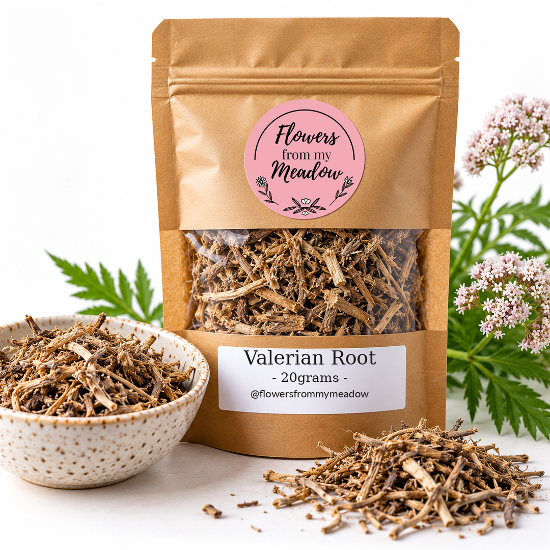 Flowers from my Meadow Valerian Root 20g in a resealable kraft pouch with the original pink round logo and one white product label, showing fibrous beige-brown dried valerian root through the transparent window, with cut root pieces and pale pink valerian flowers.