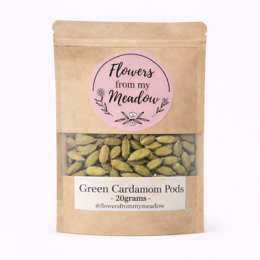 Kraft paper packaging with green cardamom pods and 'Flowers from my Meadow' label on a white background