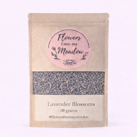 Kraft paper packaging of lavender blossoms with a pink label on a light purple background