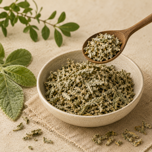 Dried Mullein leaves measured with a wooden spoon for preparing Mullein tea