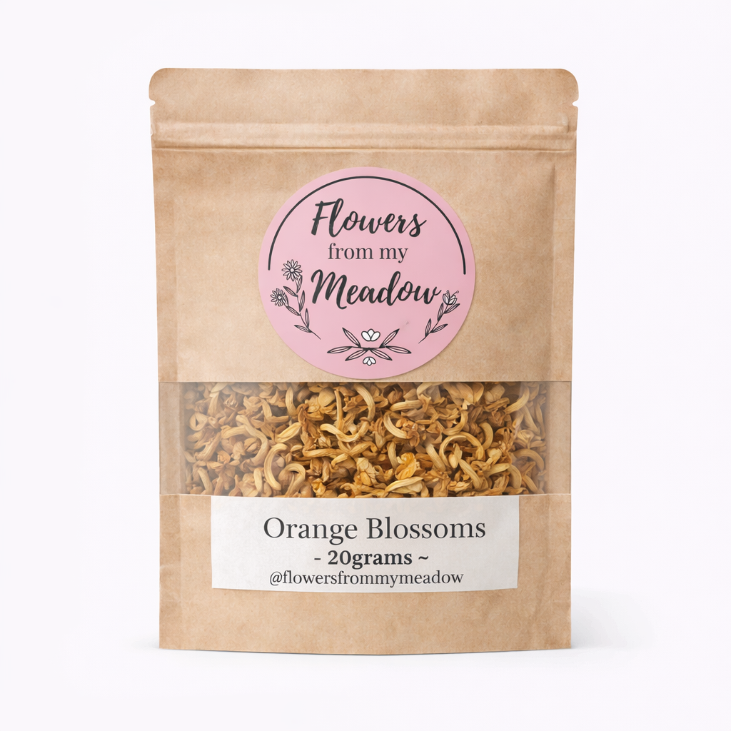 Kraft paper packaging with a label for 'Flowers from my Meadow' orange blossoms on a white background.