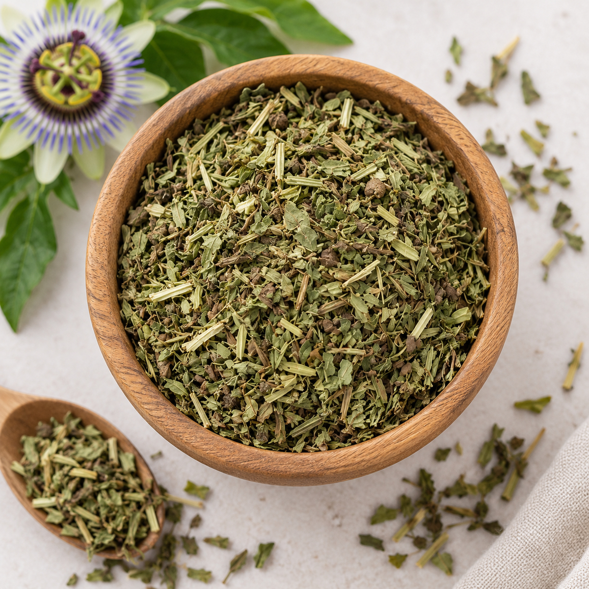 Dried Passion Flower Herb in a wooden bowl showing the natural leaves and stems of Passiflora incarnata