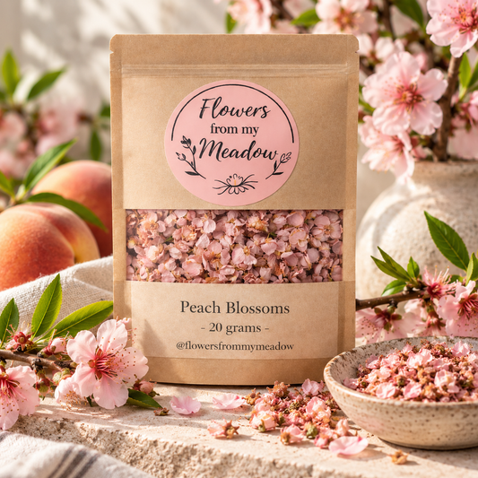 Peach Blossoms 20 g resealable kraft pouch filled with dried pink blossoms, styled with fresh peach flowers, green leaves and ripe peaches