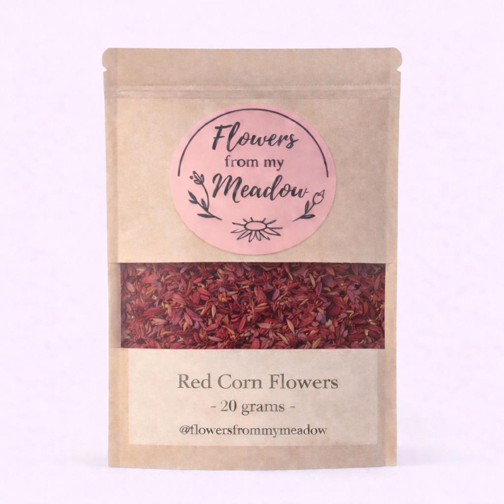Package of 'Red Corn Flowers' from 'Flowers from my Meadow' on a light pink background